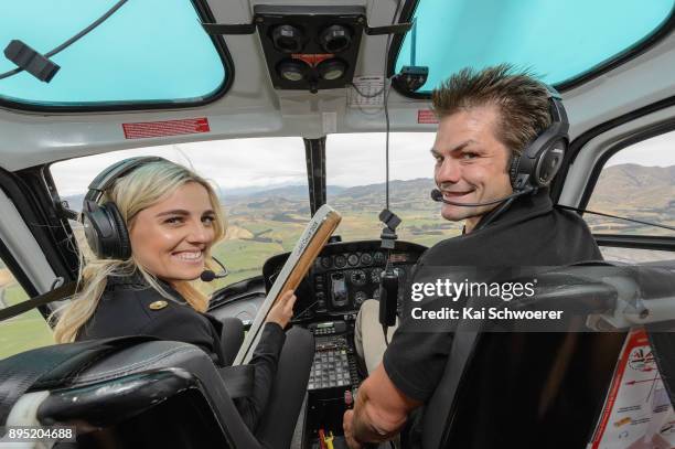 Former All Blacks captain Richie McCaw and former New Zealand hockey player Gemma McCaw pose with the Commonwealth Games Queen's baton on their way...