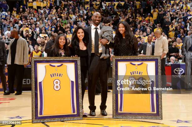 Kobe Bryant and his family pose for a photo after the jersey retirement ceremony on December 18, 2017 at STAPLES Center in Los Angeles, California....