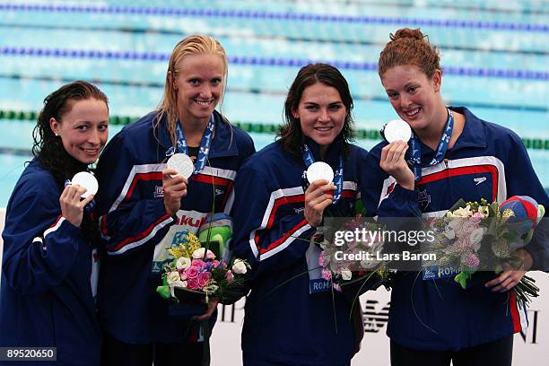 Dana Vollmer , Lacey Nymeyer , Ariana Kukors and Allison Schmitt of United States receive the silver medal during the medal ceremony for the Women's...