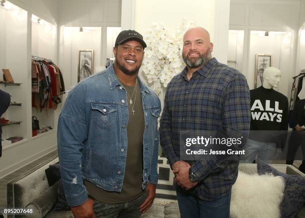 Guard Rodger Saffold and offensive tackle Andrew Whitworth attend the LA Rams Wives and Girlfriends Holiday Gifting Event at Westfield Topanga Mall...