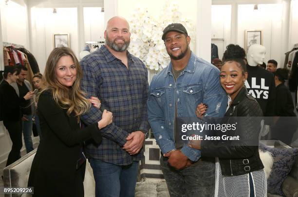 Melissa Whitworth, NFL offensive tackle Andrew Whitworth, NFL guard Rodger Saffold and Asia Saffold attend the LA Rams Wives and Girlfriends Holiday...