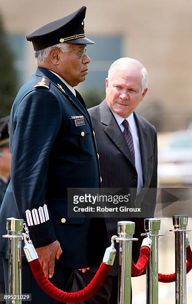 Secretary of Defense Robert M. Gates and Mexico's Secretary of National Defense Gen. Guillermo Galvan inspect the troops at the Pentagon July 30,...