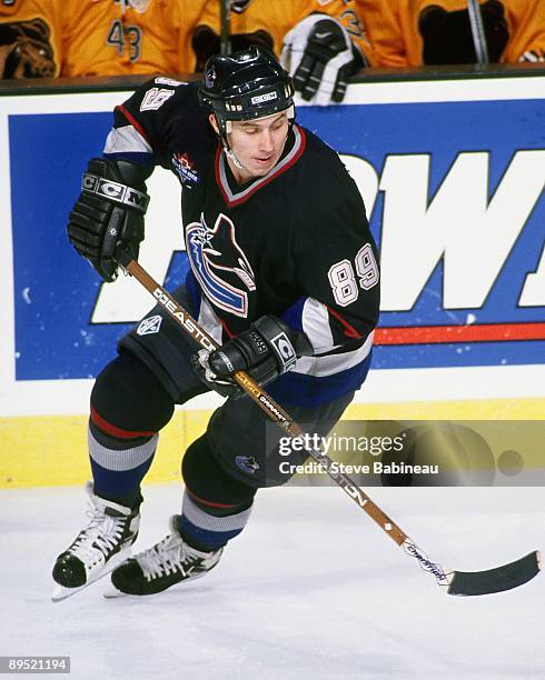 Alexander Mogilny of the Vancouver Canucks skates against the Boston Bruins at the Fleet Center.