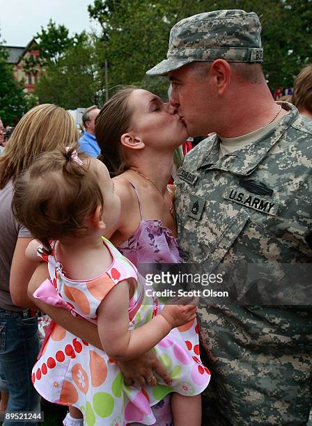 Matthew Burleson of Company D, 1st Battalion, 178th Infantry of the Illinois Army National Guard is welcomed home by his wife Nadine and his...