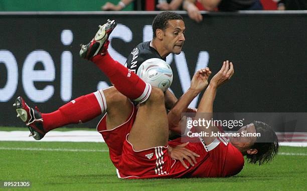 Mario Gomez of Bayern and Rio Ferdinand of Manchester fight for the ball during the Audi Cup tournament final match FC Bayern Muenchen v Manchester...