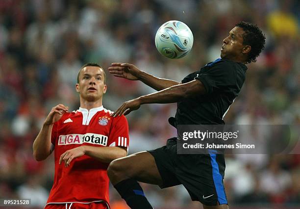 Alexander Baumjohann of Bayern and Nani of Manchester fight for the ball during the Audi Cup tournament final match FC Bayern Muenchen v Manchester...