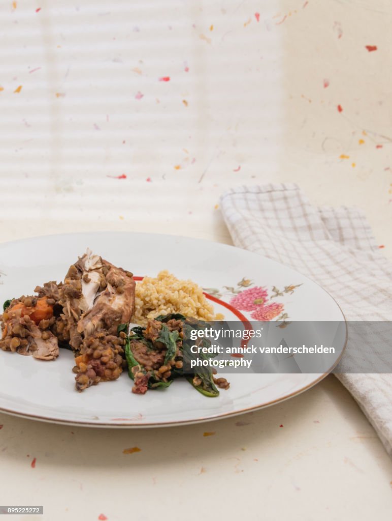 Chicken with lentils, spinach and bulgur.