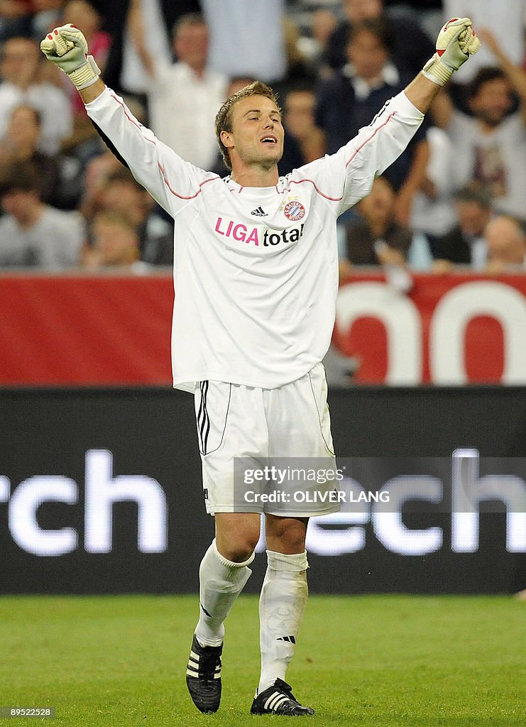 Michael Rensing Bayern Bayern Munich's goalkeeper Michael Rensing celebrates making a save ...