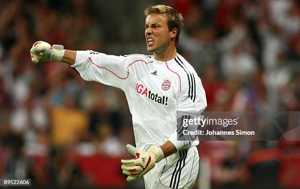 Michael Rensing, goalkeeper of Bayern celebrates after saving the ball during the penalty shootout of the Audi Cup tournament final match FC Bayern...