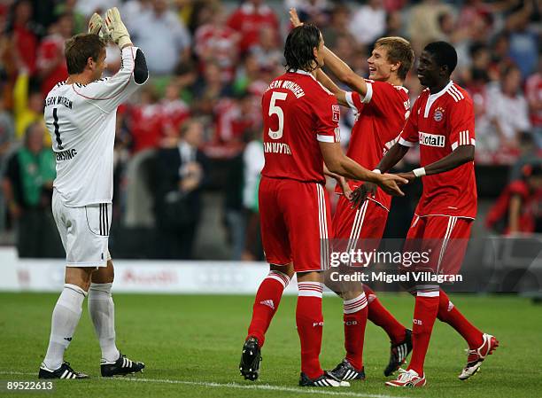 Goalkeaper Michael Rensing, Daniel van Buyten, Holger Badstuber and Saer Sene of Muenchen react after winning the Audi Cup tournament final match...