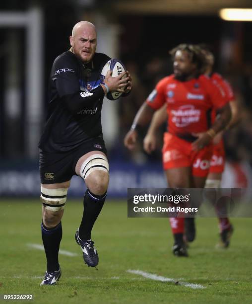 Matt Garvey of Bath runs with the ball during the European Rugby Champions Cup match between Bath Rugby and RC Toulon at the Recreation Ground on...