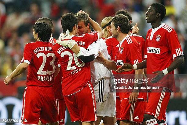 Michael Rensing , goalkeeper of Bayern celebrates with his teammates after winning the penalty shootout of the Audi Cup tournament final match FC...