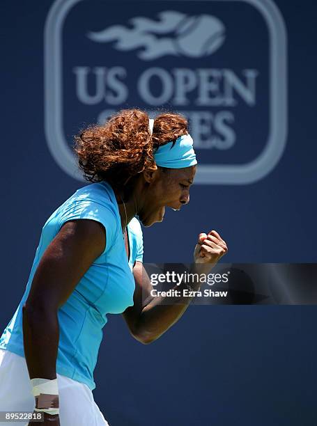 Serena Williams of the USA celebrates winning a point in the second set tie breaker of her match against Melinda Czink of Hungary on Day 4 of the...