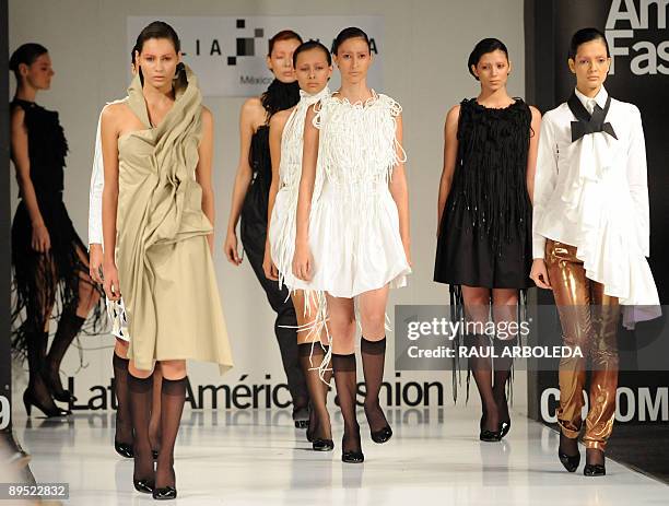 Models present creations by Mexican designers Julia and Renata during the Colombiamoda fashion show on July 30 in Medellin, Antioquia department,...