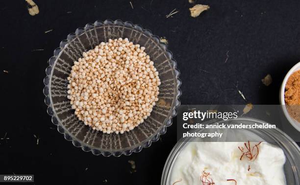 puffed quinoa, sheep yogurt with saffron and coconut blossom sugar. - golden coconut stock pictures, royalty-free photos & images