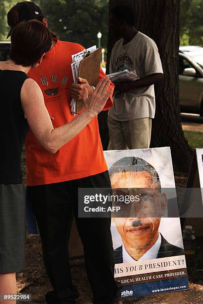 An activist with Lyndon LaRouche's group the LaRouche movement argues with a participant at the "Medicare: Made in America-DC Lobby Day and Rally" on...