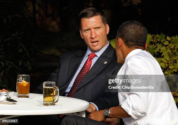 Cambridge Police Sgt. James Crowley talks with President Barack Obama while drinking beer with Harvard Professor Henry Louis Gates in the Rose Garden...