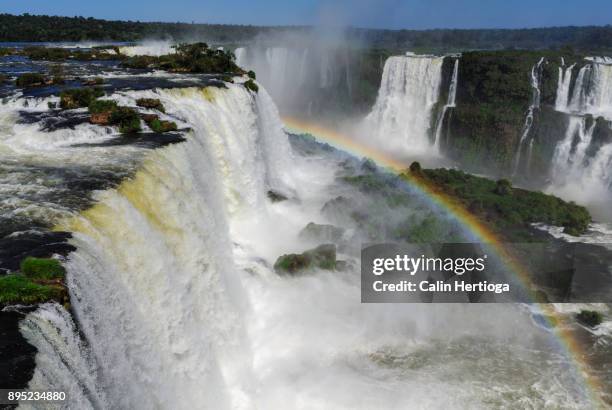 rainbow at the iguazu / iguacu waterfalls, brazilian side - iguazu falls stock pictures, royalty-free photos & images