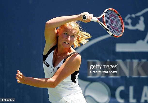 Alla Kudryavtseva of Russia returns a shot to Venus Williams of the USA during their match on Day 4 of the Bank of the West Classic at Stanford...