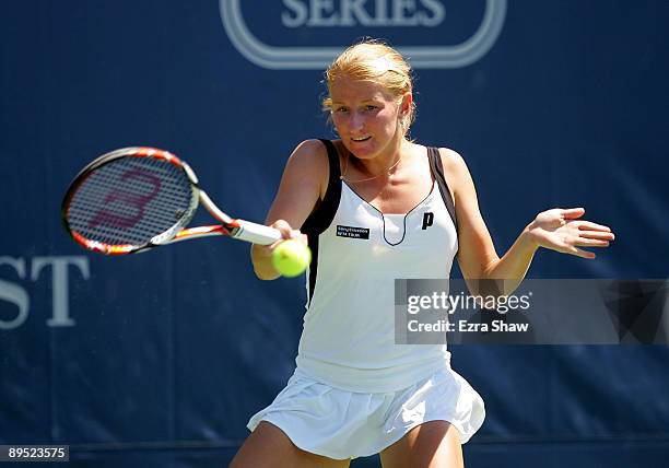 Alla Kudryavtseva of Russia returns a shot to Venus Williams of the USA during their match on Day 4 of the Bank of the West Classic at Stanford...