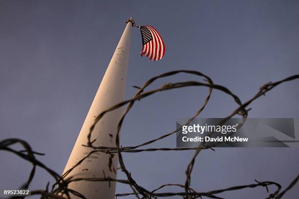 Barbed wire wraps surrounds the base of a flag pole erected by Minutemen-style activists where US Border Patrol agents are carrying out special...