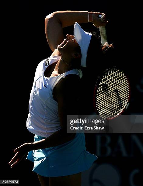 Marion Bartoli of France serves to Melanie Oudin of the USA during their match on Day 4 of the Bank of the West Classic at Stanford University on...