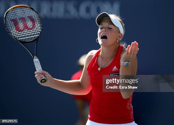 Melanie Oudin of the USA reacts after losing a point in her match against Marion Bartoli of France on Day 4 of the Bank of the West Classic at...