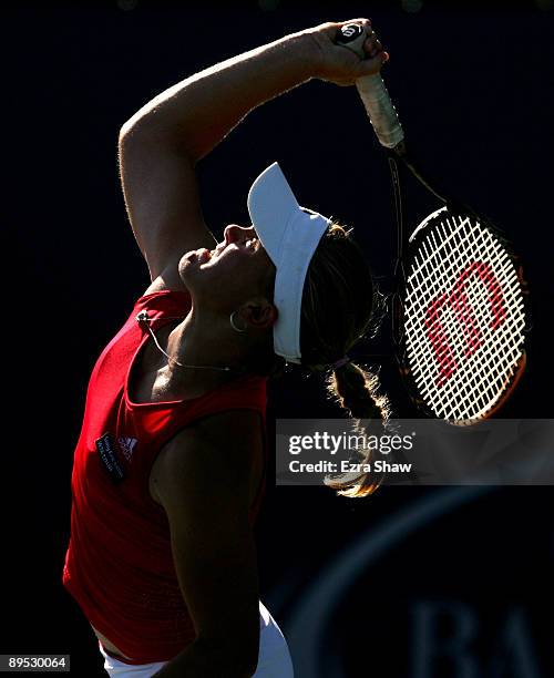 Melanie Oudin of the USA serves to Marion Bartoli of France during their match on Day 4 of the Bank of the West Classic at Stanford University on...