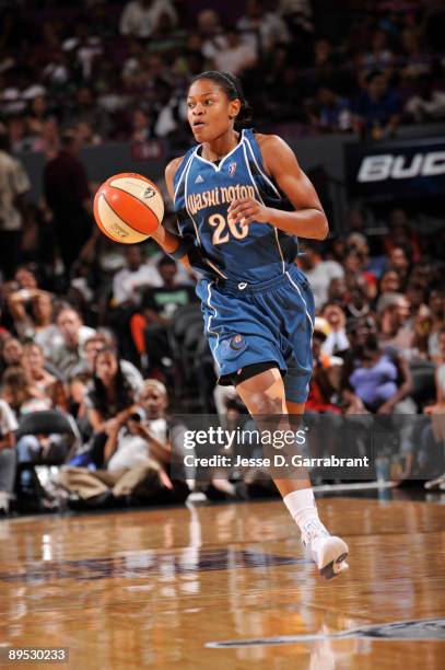 Alana Beard of the Washington Mystics drives down the court against the New York Liberty on July 30, 2009 at Madison Square Garden in New York City....