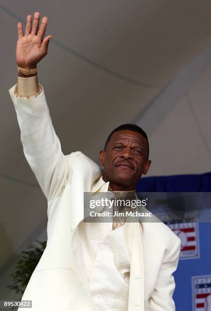 Inductee Rickey Henderson waves to the crowd at Clark Sports Center during the Baseball Hall of Fame induction ceremony on July 26, 2009 in...