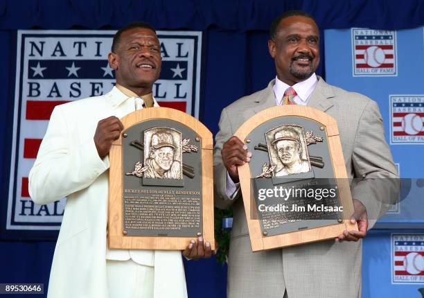 Inductees Rickey Henderson and Jim Rice pose for a photograph with their plaques at Clark Sports Center during the Baseball Hall of Fame induction...