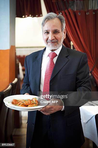 Ahmed Aslam Ali, the owner of the Shish Mahal restaurant in Glasgow, is pictured in his restaurant on July 29, 2009. The Ali family, owners of Shish...