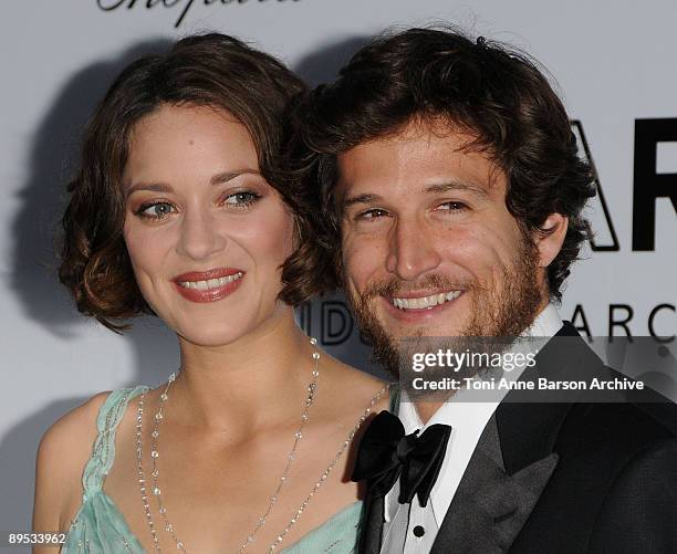 Actress Marion Cotillard and actor Guillaume Canet attends the amfAR Cinema Against AIDS 2009 benefit at the Hotel du Cap during the 62nd Annual...
