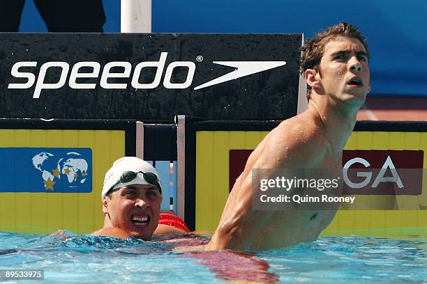 Michael Phelps of the United States looks up at the scoreboard in the Men's 100m Butterfly Heats during the 13th FINA World Championships at the...