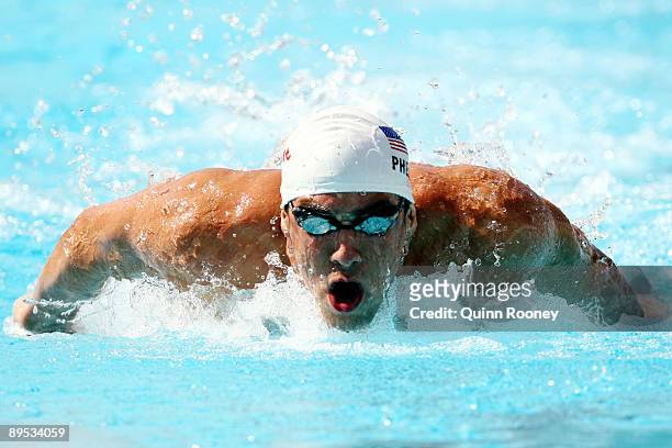 Michael Phelps of the United States competes in the Men's 100m Butterfly Heats during the 13th FINA World Championships at the Stadio del Nuoto on...
