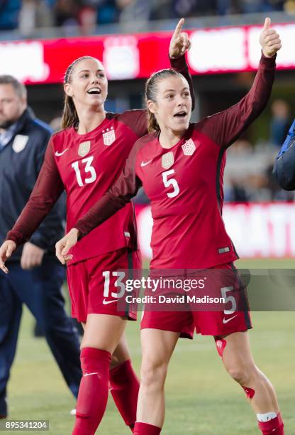 Alex Morgan and Kelley O'Hara of the USA gesture to the crowd following an international friendly against Canada on November 12, 2017 at Avaya...