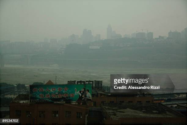 Large advertising billboard in front of the Yangtze river, in Chongqing. The city of Chongqing is one of the fastest-growing urban centres on the...