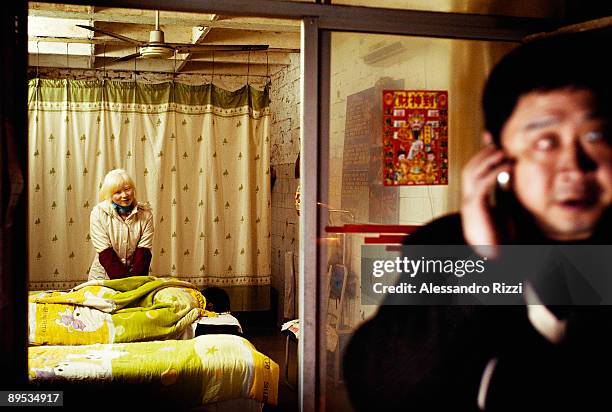 Blind masseuse gives a client a massage, in Chongqing. The city of Chongqing is one of the fastest-growing urban centres on the planet. It is...