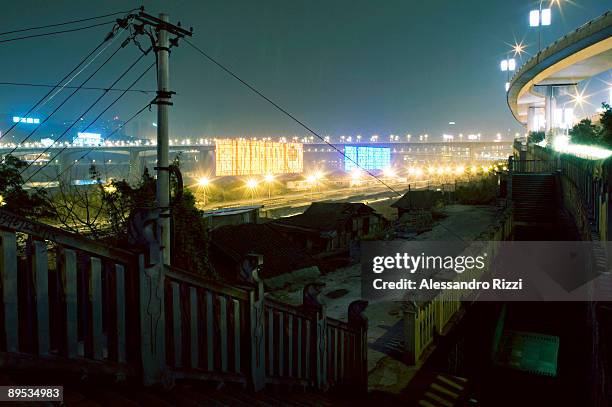 Night view of Chongqing from the old city. The city of Chongqing is one of the fastest-growing urban centres on the planet. It is changing...