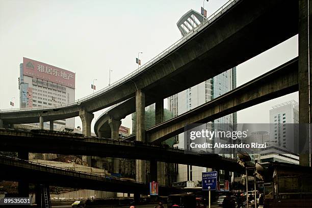 Roads cross over each other, near the railway station in Chongqing. The city of Chongqing is one of the fastest-growing urban centres on the planet....