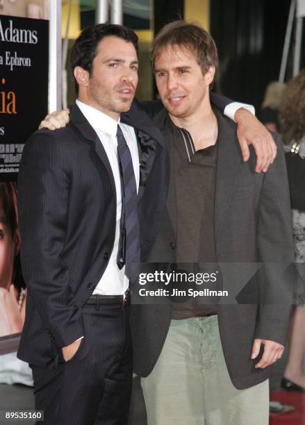Actors Chris Messina and Sam Rockwell attend the "Julie & Julia" premiere at the Ziegfeld Theatre on July 30, 2009 in New York City.