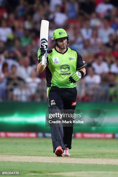 Shane Watson of the Thunder celebrates his half century during the Big Bash League match between the Sydney Thunder and the Sydney Sixers at Spotless...