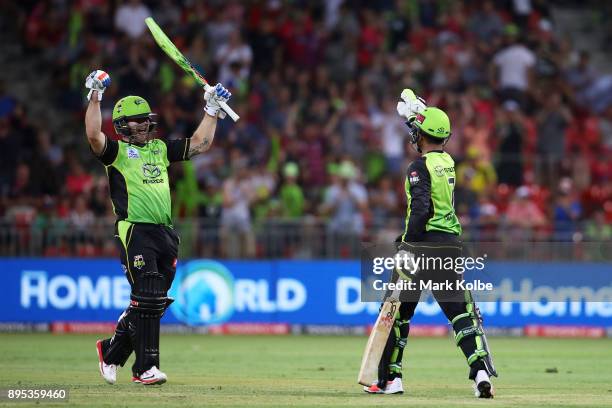 Aiden Blizzard and Arjun Nair of the Thunder celebrate victory during the Big Bash League match between the Sydney Thunder and the Sydney Sixers at...