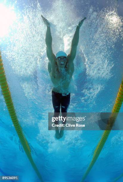 Michael Phelps of the United States competes in the Men's 100m Butterfly Heats during the 13th FINA World Championships at the Stadio del Nuoto on...