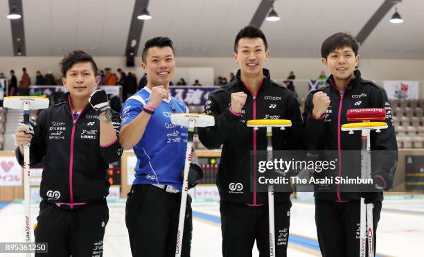Team Karuizawa players celebrate winning the men's championship during day four of the Karuizawa International Curling Championships at the Karuizawa...