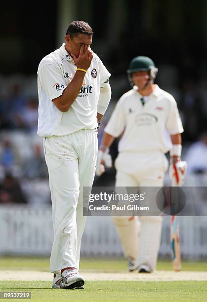 Andre Nel of Surrey looks dejected during day one of the LV County Championship Division Two match between Surrey and Leicestershire at The Oval on...