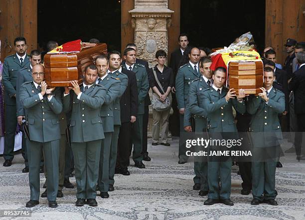 Members of Spain's Civil Guards carry the coffin of a colleague killed in a car bomb attack in Palma de Mallorca, July 31, 2009. Two guards, Carlos...
