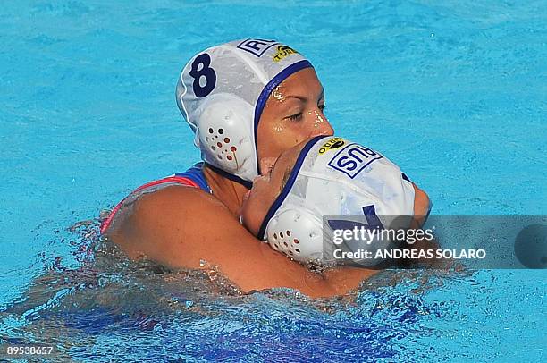 Russian Evgenia Ivanova celebrates with her teammate Ekaterina Pantyulina after their victory over Greece at the end of the Women' water-polo...