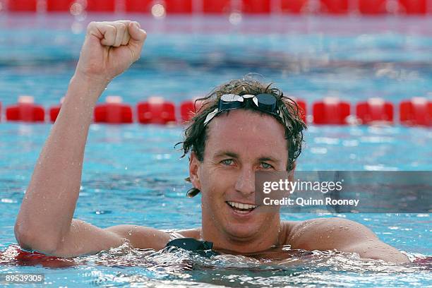 Aaron Peirsol of the United States celebrates after breaking the world record setting a new time of 1:51.92 seconds in the Men's 200m Backstroke...