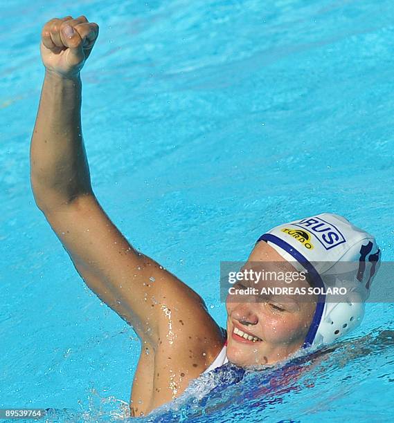 Russian Evgenia Ivanova jubilates as she scores a goal against Greece during the Women' water-polo Bronze-Medal match on July 31, 2009 at the FINA...